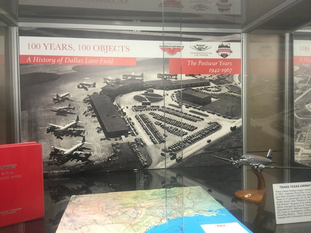Picture1 - Toronto Bangla Town | Digital Bangla Weekly Magazine Exhibit panel showing a historic aerial photo of Dallas Love Field with vintage aircraft and 1942–1967 postwar display text.