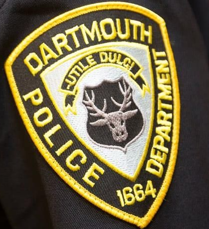 Picture5 - Toronto Bangla Town | Digital Bangla Weekly Magazine Dartmouth Police Department patch on dark fabric; yellow-edged shield with a deer head emblem and the words 'Dartmouth Police Department' around the border.